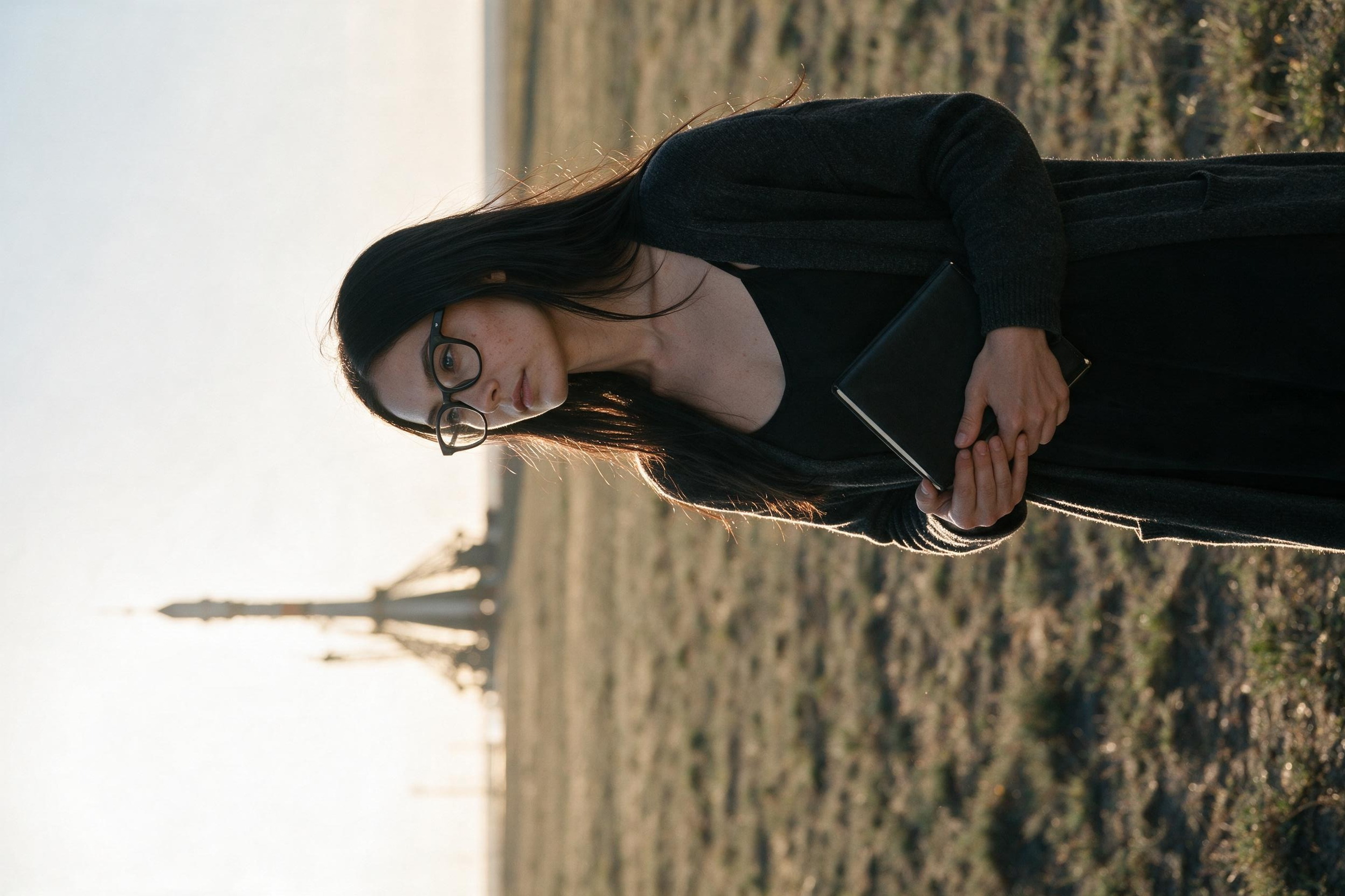 Me on the Kazakh steppe with a notebook, launch gantry in the distance.