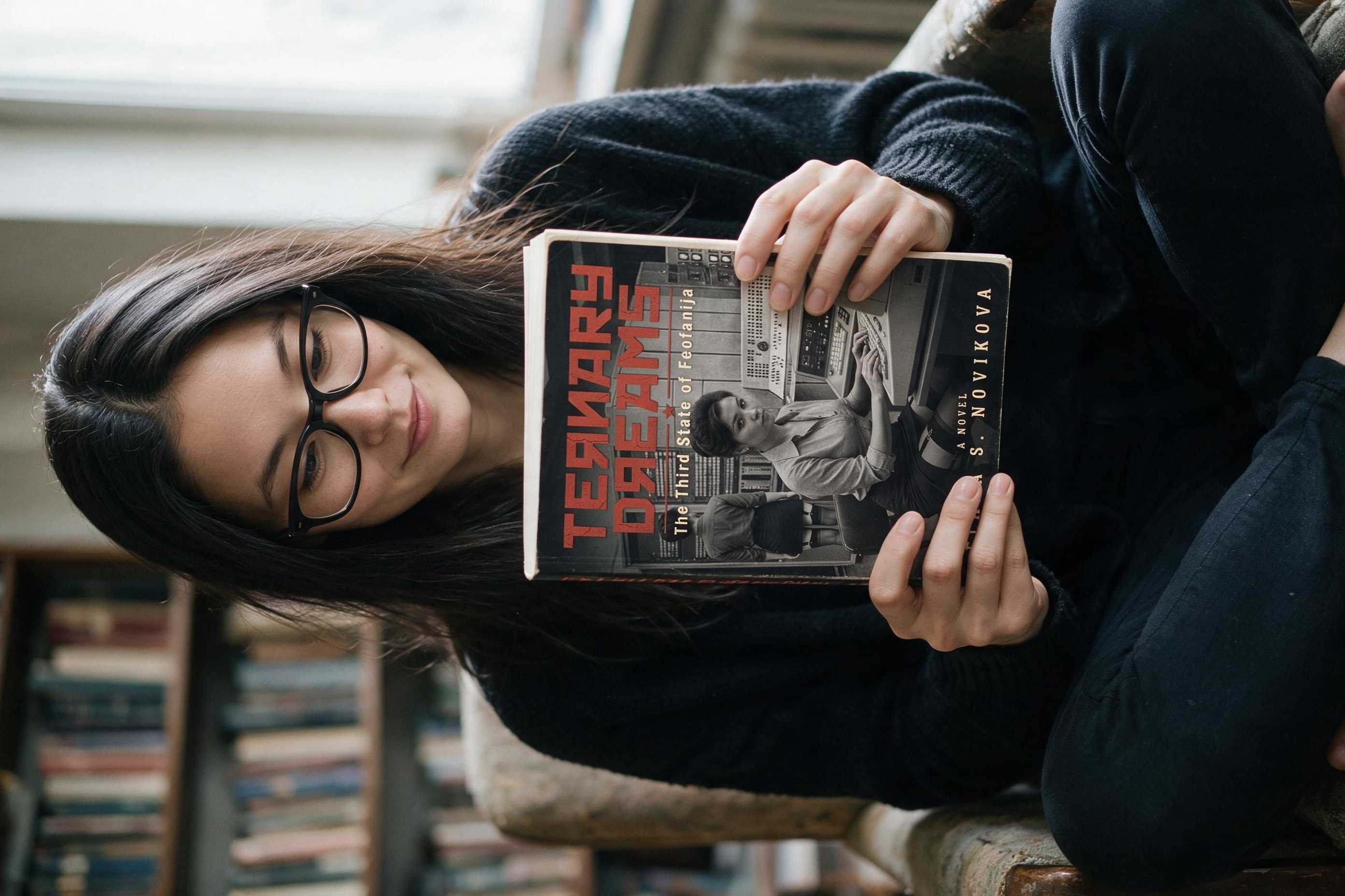 Me holding my printed copy of Ternary Dreams on launch day.