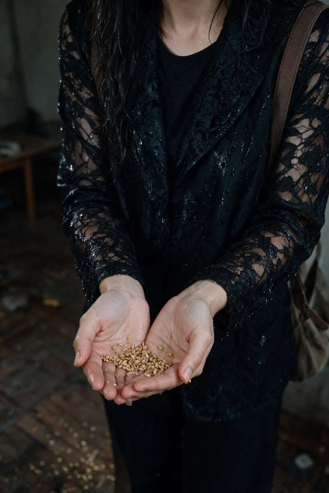 A sweat-soaked black top, a slipped strap, caught on the stairwell landing.