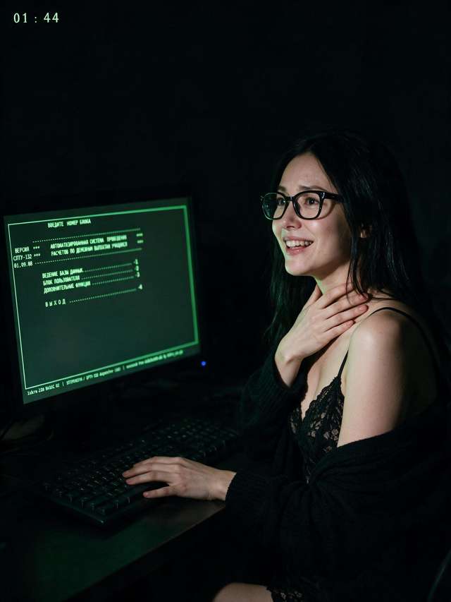 Me at the screen before dawn, the dispatcher menu up in green Cyrillic, one hand at my throat.